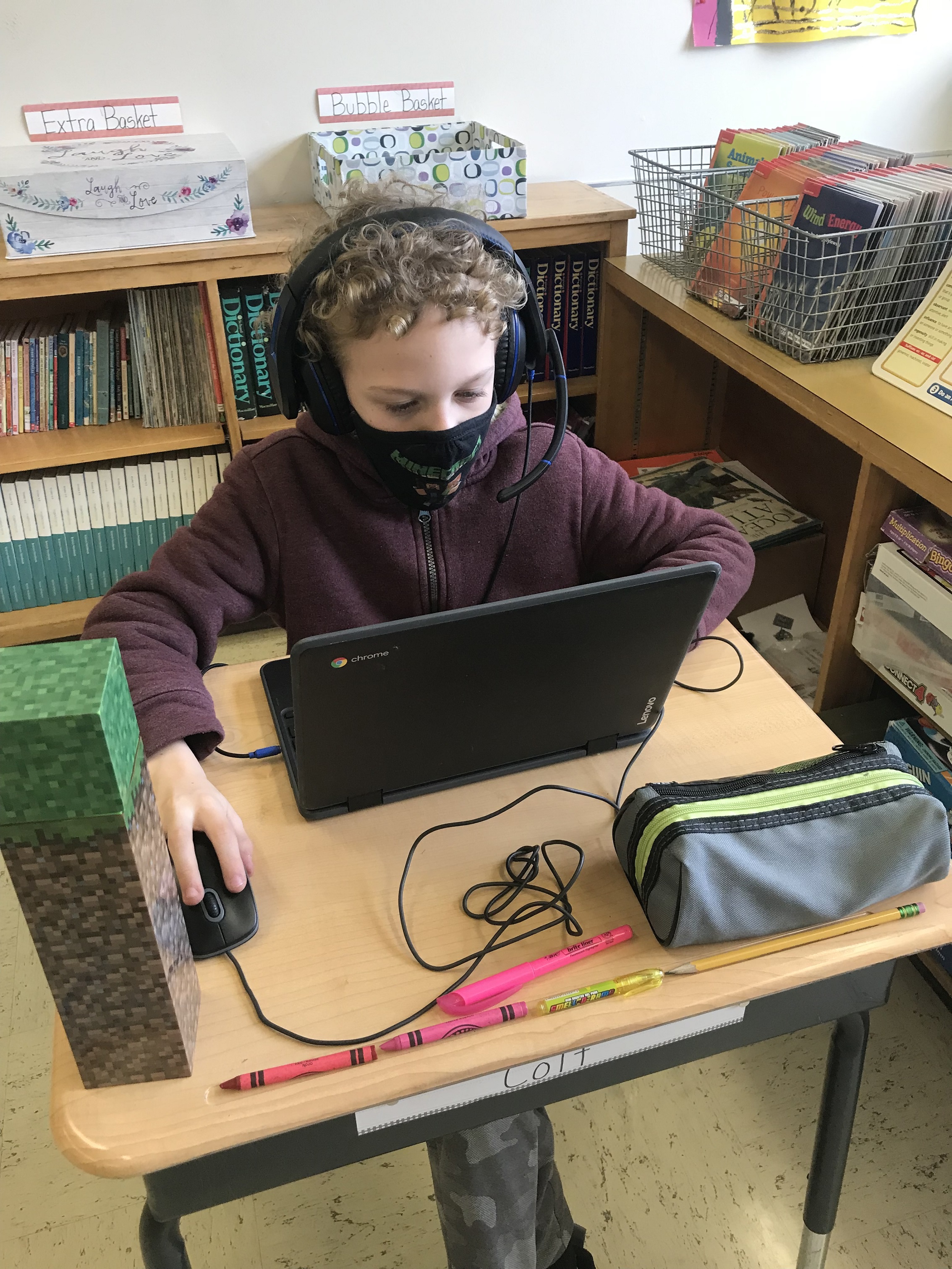 North Bay Elementary student with headphones and Chromebook