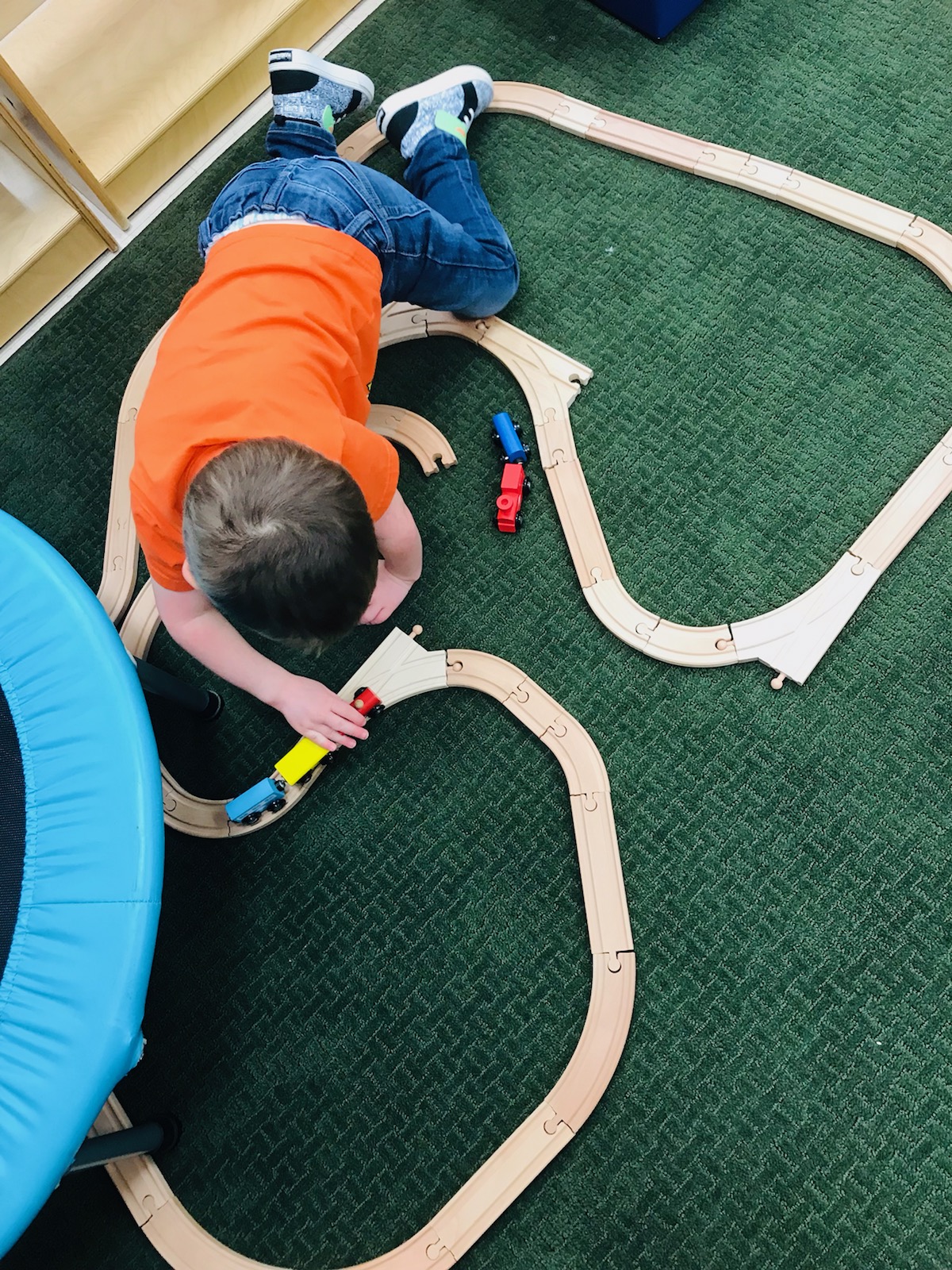 A Yoncall Early Childhood student with a train set